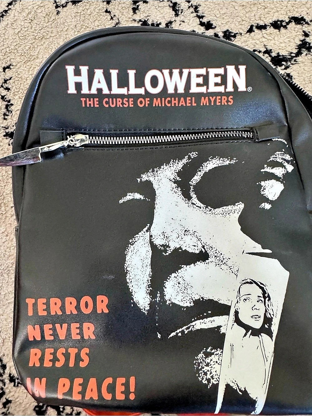 Halloween The Curse of Michael Myers Graphic Backpack in Black & Orange